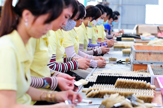 Ford workers in the assembly line